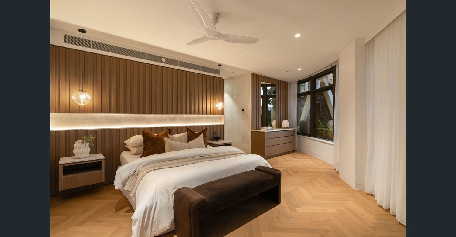 Master bedroom with fluted timber feature wall