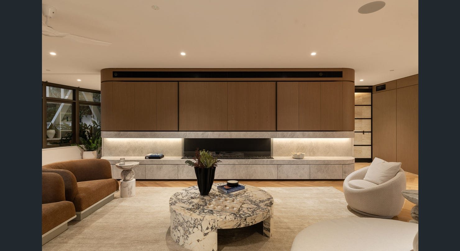 Living room joinery wall with integrated fireplace